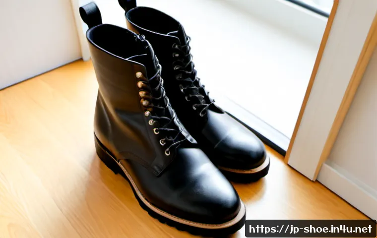 닥터마틴 블레이크와 첼시 부츠 추천 - Photorealistic editorial product comparison of two pairs of premium black leather ankle boots on a c...